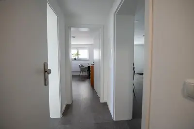Ein Bett oder Betten in einem Zimmer der Unterkunft W&P Living Wohnung mit Ausblick - Parkplatz