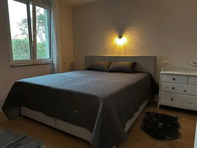 Ein Bett oder Betten in einem Zimmer der Unterkunft Wohnung Hartsee