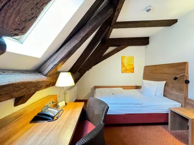 Ein Bett oder Betten in einem Zimmer der Unterkunft Hotel Haimerlhof