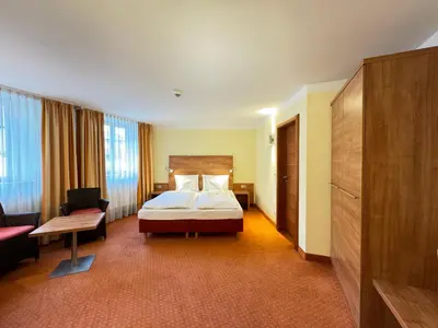 Ein Bett oder Betten in einem Zimmer der Unterkunft Hotel Haimerlhof
