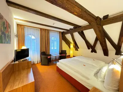 Ein Bett oder Betten in einem Zimmer der Unterkunft Hotel Haimerlhof
