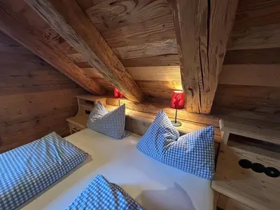 Ein Bett oder Betten in einem Zimmer der Unterkunft Naturhotel & Bayernhütte am Brauneck