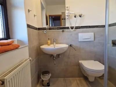 Ein Badezimmer in der Unterkunft Pension Aufeld