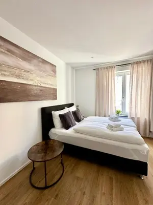 Ein Bett oder Betten in einem Zimmer der Unterkunft Spiritus Apartments