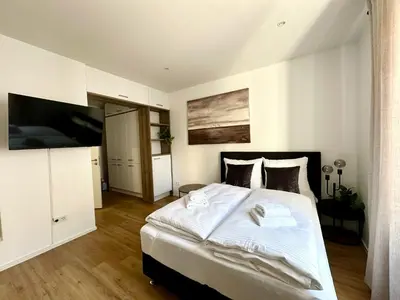 Ein Bett oder Betten in einem Zimmer der Unterkunft Spiritus Apartments