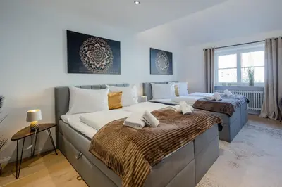 Ein Bett oder Betten in einem Zimmer der Unterkunft UNiQE I Luxuriöses 145qm Apartment