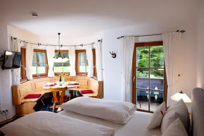 Ein Bett oder Betten in einem Zimmer der Unterkunft Obernacher Hof