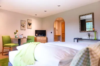 Ein Bett oder Betten in einem Zimmer der Unterkunft Obernacher Hof