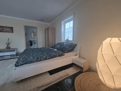 Ein Bett oder Betten in einem Zimmer der Unterkunft Marmor Oase