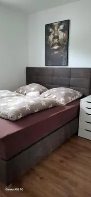 Ein Bett oder Betten in einem Zimmer der Unterkunft FERIEN-Geschäftswohnung