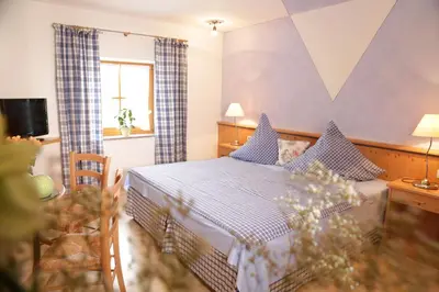 Ein Bett oder Betten in einem Zimmer der Unterkunft Lindlweberhof