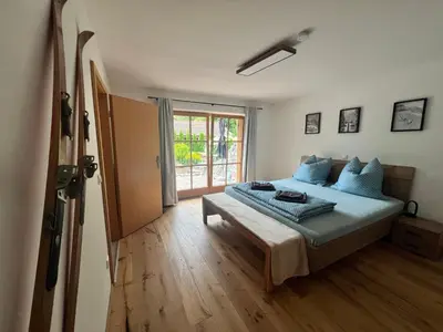Ein Bett oder Betten in einem Zimmer der Unterkunft Ferienwohnung Mühlleiten