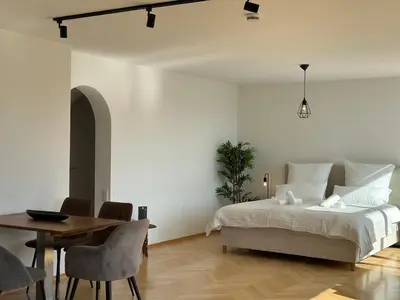 Ein Bett oder Betten in einem Zimmer der Unterkunft Flow Living I Penthouse mit Dachterrasse I 5 Min zum Ammersee