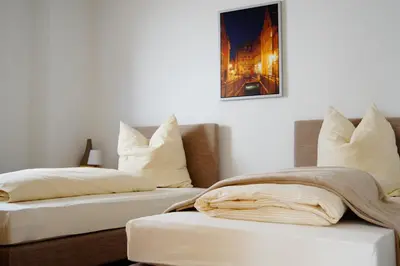 Ein Bett oder Betten in einem Zimmer der Unterkunft Augusta-Refugium