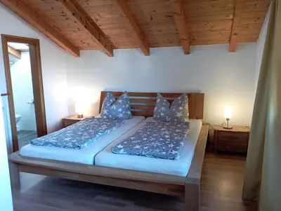 Ein Bett oder Betten in einem Zimmer der Unterkunft Birgits Ferienwohnung