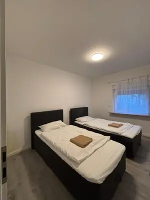 Ein Bett oder Betten in einem Zimmer der Unterkunft TopLageEG