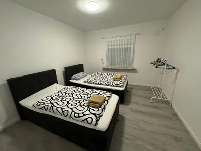 Ein Bett oder Betten in einem Zimmer der Unterkunft TopLageEG