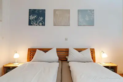 Ein Bett oder Betten in einem Zimmer der Unterkunft Fewo Amelie