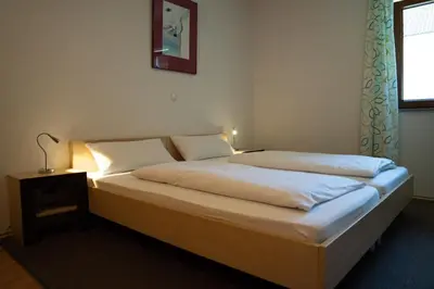 Ein Bett oder Betten in einem Zimmer der Unterkunft Gästehaus Roming