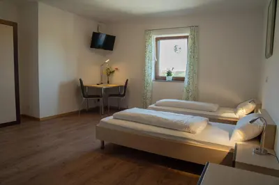 Ein Bett oder Betten in einem Zimmer der Unterkunft Gästehaus Roming