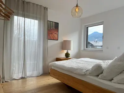 Ein Bett oder Betten in einem Zimmer der Unterkunft Ferienhaus Laurentius für 12 Personen in Ohlstadt