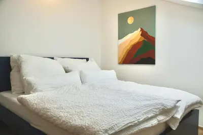 Ein Bett oder Betten in einem Zimmer der Unterkunft Ferienhaus Laurentius für 12 Personen in Ohlstadt