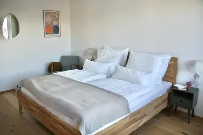 Ein Bett oder Betten in einem Zimmer der Unterkunft Ferienhaus Laurentius für 12 Personen in Ohlstadt