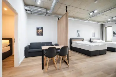 Ein Bett oder Betten in einem Zimmer der Unterkunft Homaris Apartments Isartor