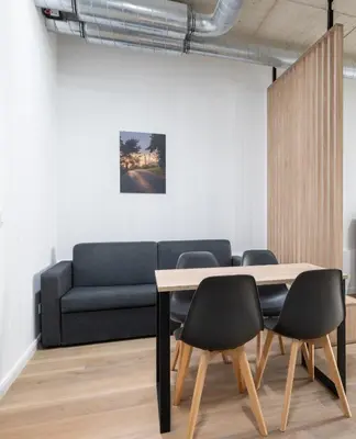 Ein Sitzbereich in der Unterkunft Homaris Apartments Isartor