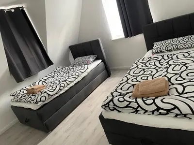 Ein Bett oder Betten in einem Zimmer der Unterkunft TopLageDG