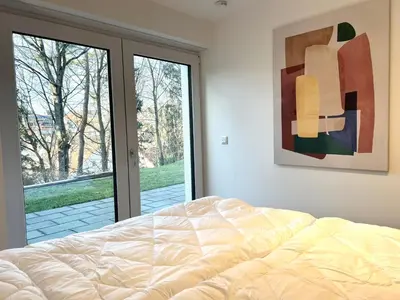 Ein Bett oder Betten in einem Zimmer der Unterkunft Perfekt für 2! Küche Netflix Terrasse Flughafen
