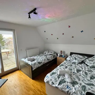Ein Bett oder Betten in einem Zimmer der Unterkunft München Haus xx Centrum xx Messe xx Oktoberfest xx