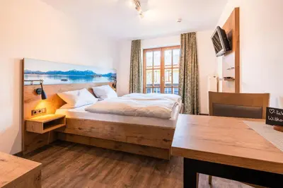 Ein Bett oder Betten in einem Zimmer der Unterkunft Gäste- und Apartmenthaus Wiesholler