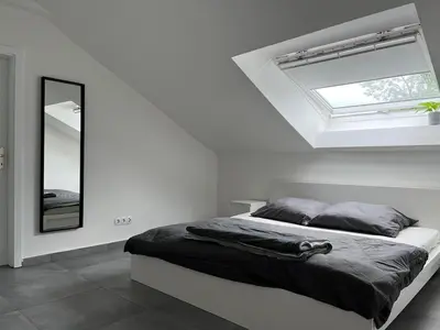 Ein Bett oder Betten in einem Zimmer der Unterkunft Helle Loft in guter Lage