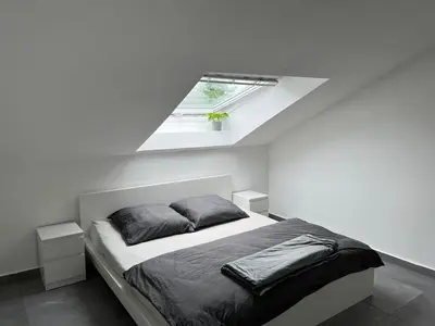 Ein Bett oder Betten in einem Zimmer der Unterkunft Helle Loft in guter Lage