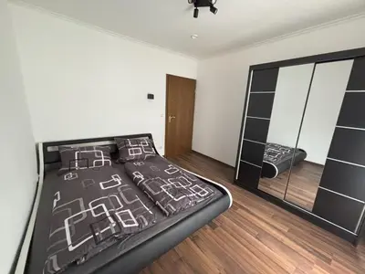 Ein Bett oder Betten in einem Zimmer der Unterkunft Ferienwohnung HUGO