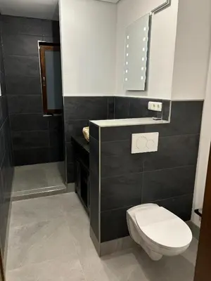 Ein Badezimmer in der Unterkunft Ferienwohnung HUGO