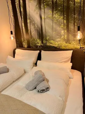 Ein Bett oder Betten in einem Zimmer der Unterkunft bloom - Zentral, modern, großzügig für 1-6 Pers