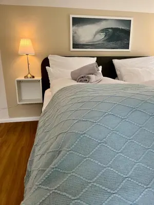 Ein Bett oder Betten in einem Zimmer der Unterkunft bloom - Zentral, modern, großzügig für 1-6 Pers