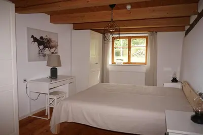 Ein Bett oder Betten in einem Zimmer der Unterkunft Ferienwohnung in der Alten Mühle Kirchdorf