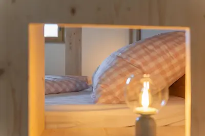 Ein Bett oder Betten in einem Zimmer der Unterkunft Ferienwohnungen Aying