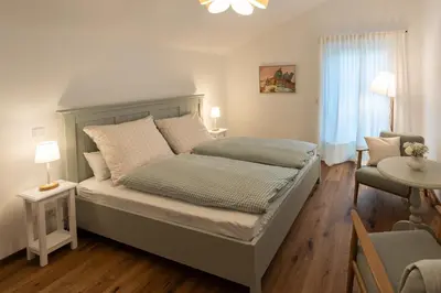 Ein Bett oder Betten in einem Zimmer der Unterkunft Ferienwohnungen Aying