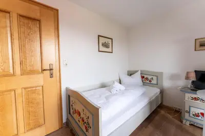 Ein Bett oder Betten in einem Zimmer der Unterkunft Ferienwohnungen Chiemgau