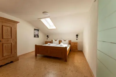 Ein Bett oder Betten in einem Zimmer der Unterkunft Ferienwohnungen Chiemgau