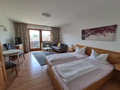 Ein Bett oder Betten in einem Zimmer der Unterkunft Gästehaus Radlerhof