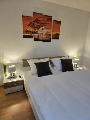 Ein Bett oder Betten in einem Zimmer der Unterkunft Ruhiges Apartment nähe Bahnhof HILTI