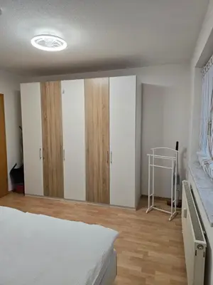 Ein Bett oder Betten in einem Zimmer der Unterkunft Ruhiges Apartment nähe Bahnhof HILTI