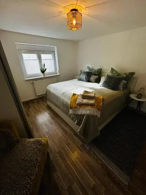 Ein Bett oder Betten in einem Zimmer der Unterkunft gemütliche Ferienwohnung mit Garten