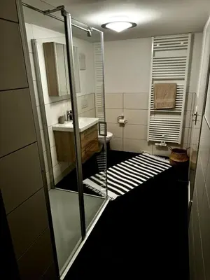 Ein Badezimmer in der Unterkunft gemütliche Ferienwohnung mit Garten