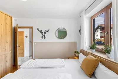 Ein Bett oder Betten in einem Zimmer der Unterkunft CASARiNA - Alpentraum am Barmsee - FeWo Lugge
